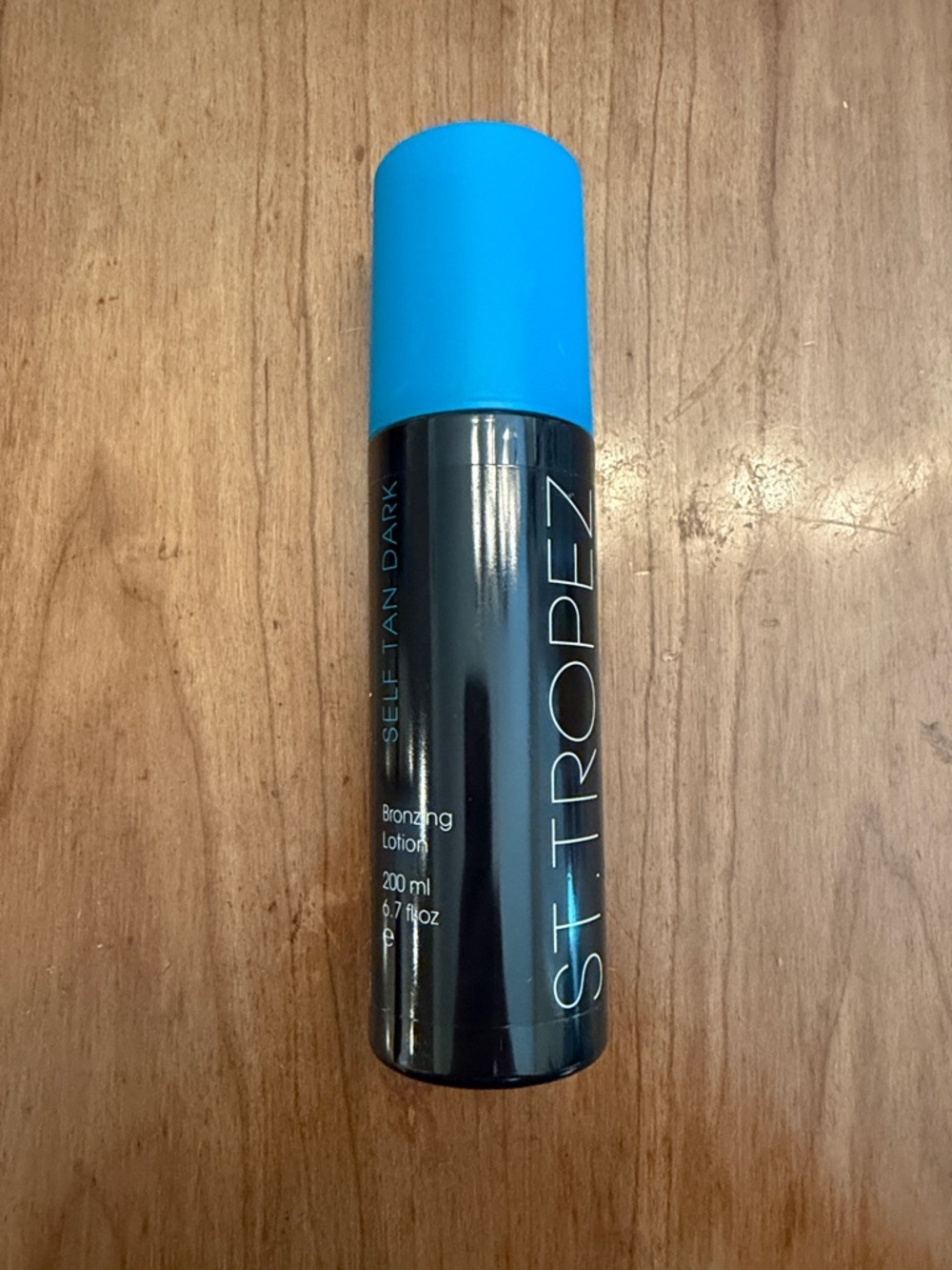 St. Tropez Black Bottle with Bright Blue Cap Self Tan Lotion